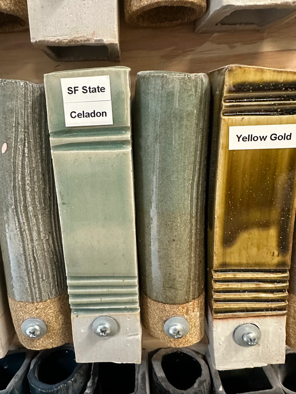Studio glaze samples, including a pale green tile labeled SF State Celadon.